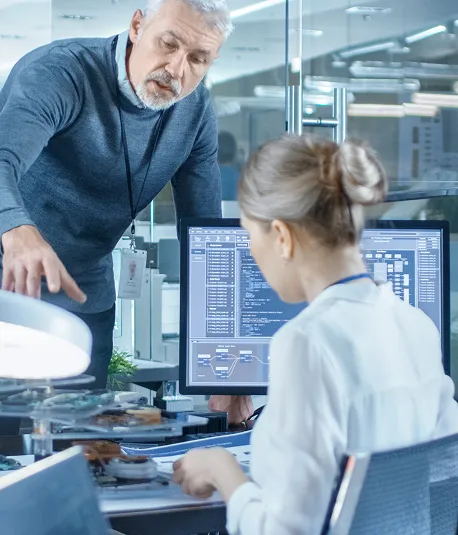 Electronics engineers working at a desk