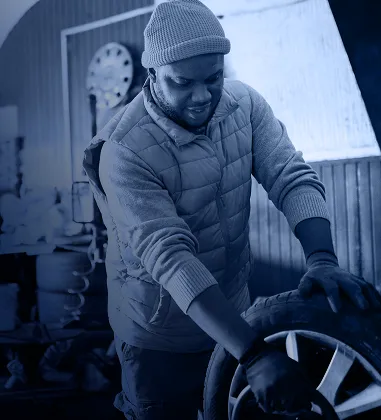 Mechanic holding a tire